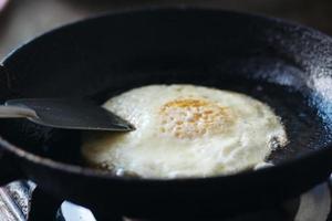 Fried eggs in the pan close up , photo