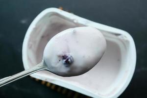 fresh yogurt on a spoon top view photo