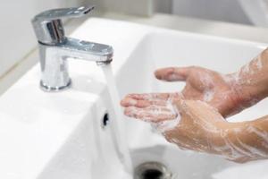 Hygiene. Cleaning Hands. Washing hands with soap under the faucet with water Pay dirt. Prevent sterilize germ bacteria disease. Health care concept. photo