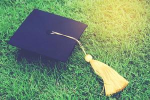 shot of graduation hats on the grass, concept during commencement success graduates of the university,Concept education congratulation. Graduation Ceremony ,Congratulated the graduates in University. photo