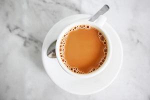 top view of cup of milk tea on table photo