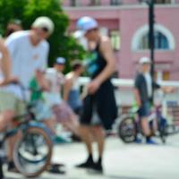 Defocused image of a lot of people with bmx bikes. Meeting of fans of extreme sports photo