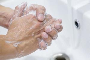 Hygiene. Cleaning Hands. Washing hands with soap under the faucet with water Pay dirt. Prevent sterilize germ bacteria disease. Health care concept. photo