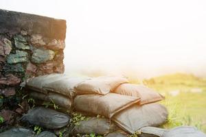 Old sandbag wall for flooding defense or fortification photo