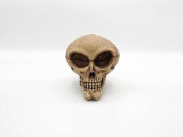 Alien skull toy model which made from plastic racin by hand photo