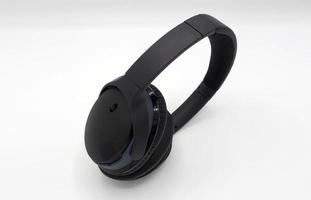 Black wireless headphone around ears. photo
