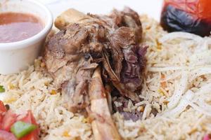 mutton biryani meal in a plate on table. photo