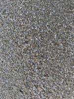 This is a picture of a background of sand on the beach that has just been washed away by the waves photo