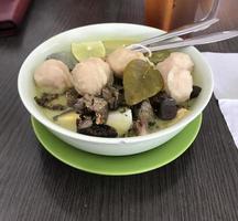 Soto is a typical Indonesian food with liver and meatball toppings plus lime as an additional flavoring. Inside there is shredded chicken with delicious warm rice photo