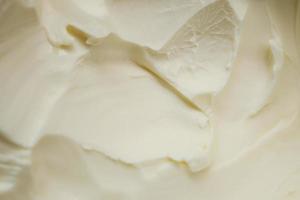 close up of fresh butter in a container photo