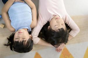 Asian kids enjoy playing in home , family lifestyle concept photo