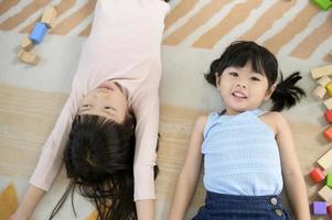 Asian kids enjoy playing in home , family lifestyle concept photo