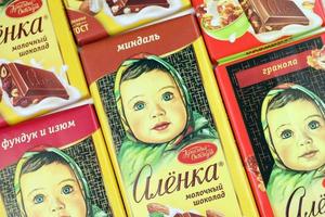 KHARKIV, UKRAINE - JANUARY 27, 2021 Alyonka chocolate square bars - product from Red October chocolate factory. Old russian traditional chocolate photo