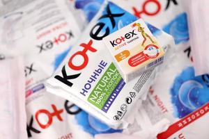 KHARKIV, UKRAINE - DECEMBER 16, 2021 Kotex production with logo. Kotex is a brand of feminine hygiene products, includes maxi, thin and ultra thin pads. photo