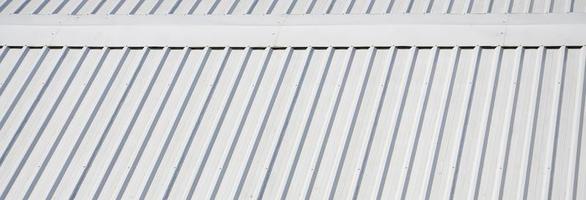 Metal gray roof with rhythmic parallel relief directions photo