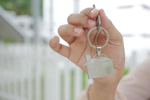 the concept of finance concept , women holding house in hand photo