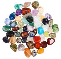 top view of various gemstones on white background photo