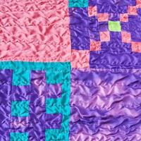 sewn pieces of fabrics in stitched silk patchwork photo