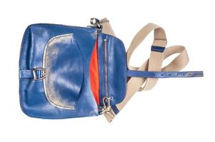 open empty blue leather handbag with textile strap photo