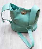 above view of turquoise colour leather handbag photo