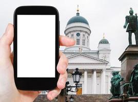 tourist photographs cathedral in Helsinki, Finland photo