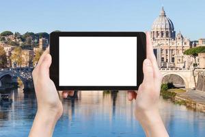 tourist photographs Rome cityscape on tablet photo