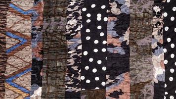 surface of handmade brown patchwork scarf photo
