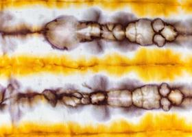 abstract spotted yellow and brown pattern in batik photo
