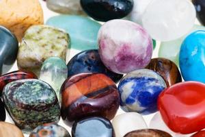 handful of various gem stones close up photo