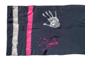 edge of scarf with handpainted handprints isolated photo