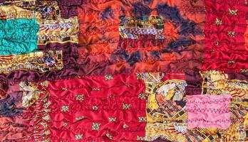 pattern of stitched red brown patchwork scarf photo