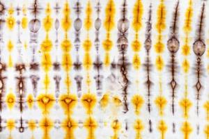 abstract yellow and brown decor in tie-dye batik photo