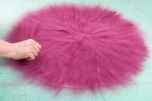 hatter spreads the second layer of wool fibers photo