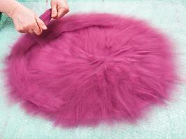 milliner spreads the second layer of wool fibers photo