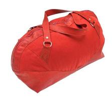 side view of red travelling bag isolated photo