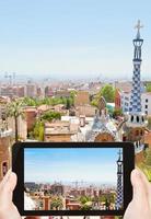 tourist taking photo of Barcelona cityscape