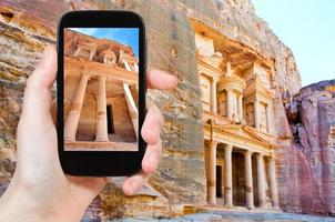 taking photo of Treasury temple in rock of Petra