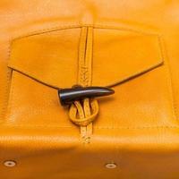 pocket of handmade yellow leather bag photo