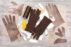 various objects for gloves production on table photo