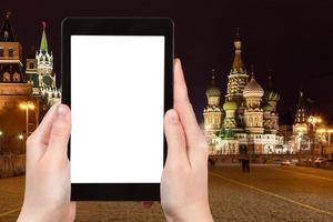 tourist photographs Red Square in night, Moscow photo