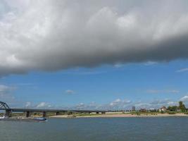 The city of Nijmegen at the river waal in the netherlands photo