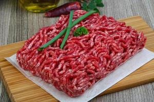 Minced beef on wood photo