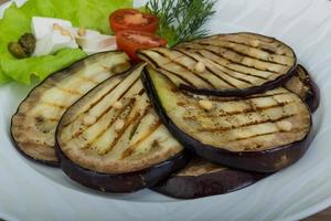 Grilled aubergine on the plate photo