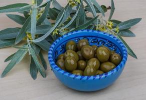 Green olives dish photo