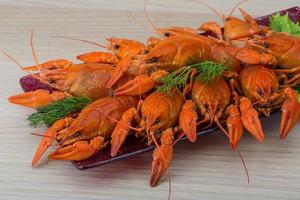 Boiled crayfish on wood photo