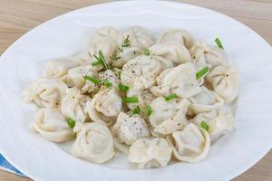 Russian dumplings on wood photo