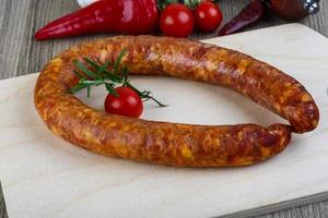 Sausage ring on wood photo