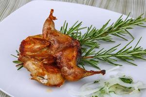 Grilled quail dish photo