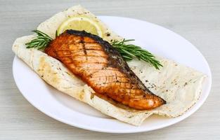 Grilled salmon on wood photo