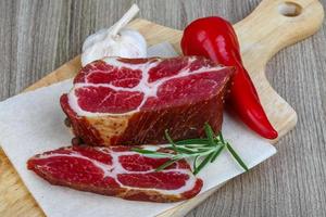 Chuck steak on wood photo